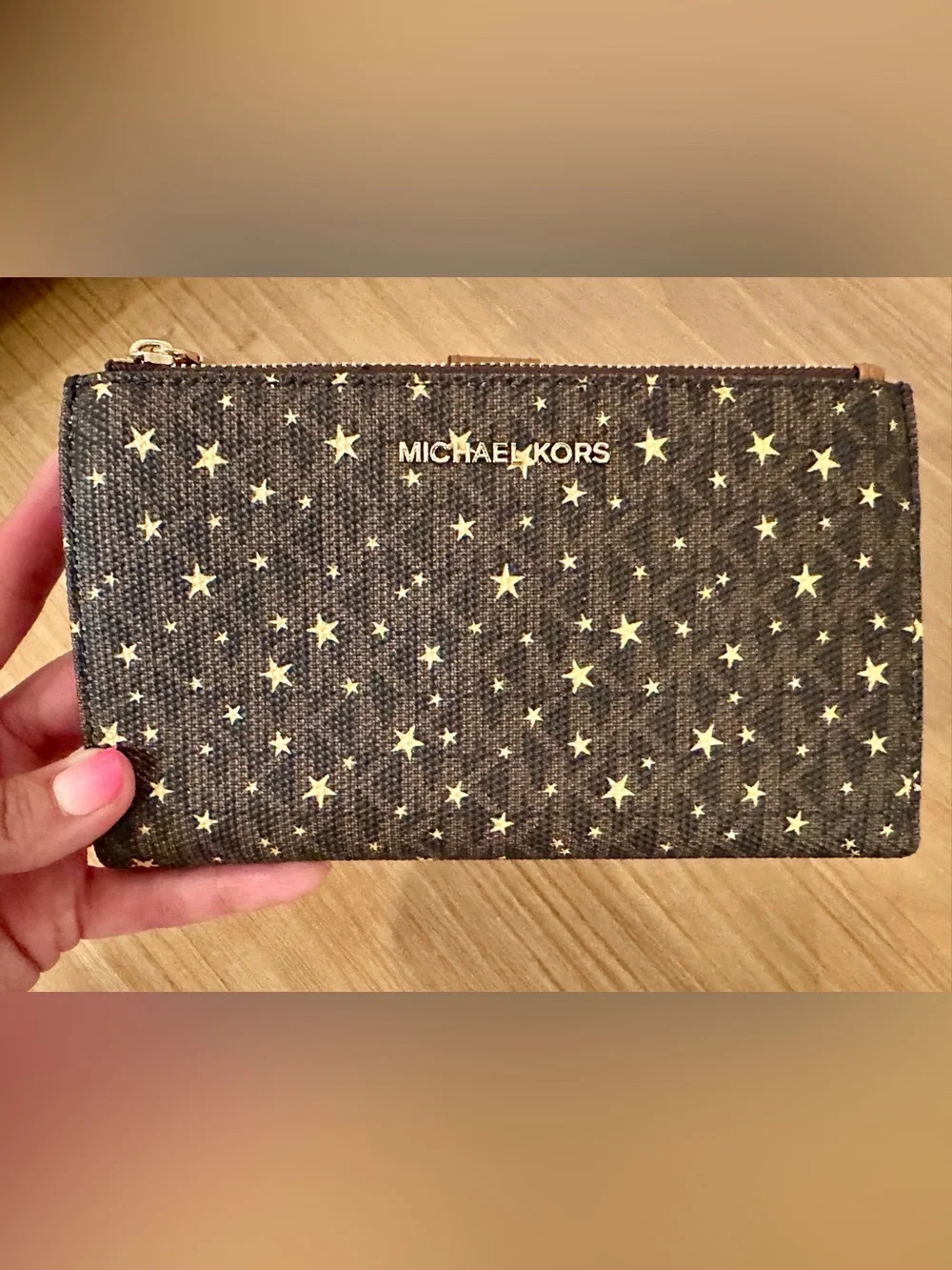 Michael Kors Black Star Print Wristlet with Tan Strap